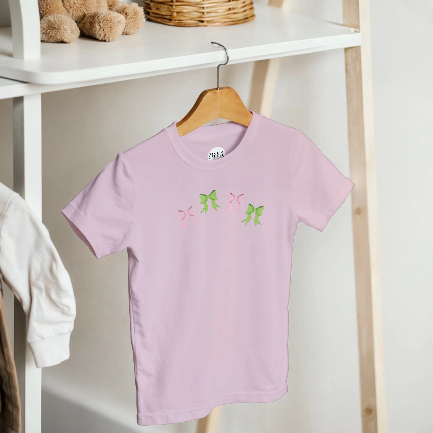 Kids pink t-shirt with pink and green bows design on front