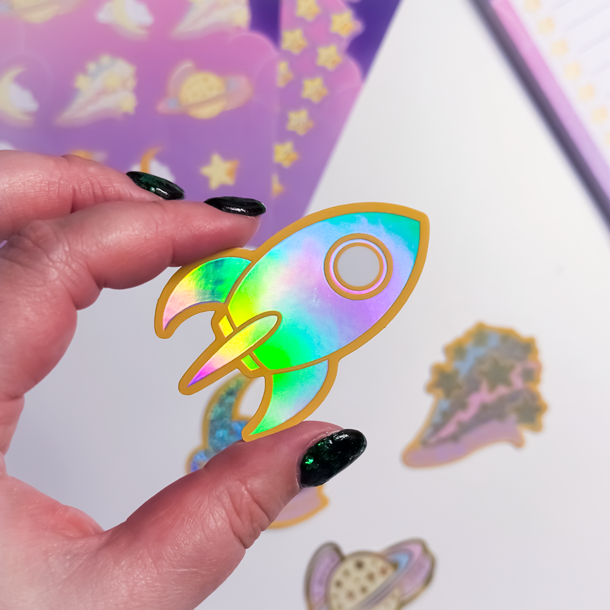 Rocket holographic sticker shimmering with rainbow colours