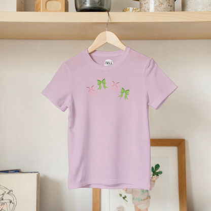 Kids pink t-shirt with pink and green bows design on front