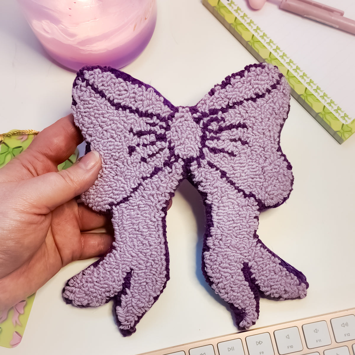 Soft pastel desk decor with lilac bow mug rug