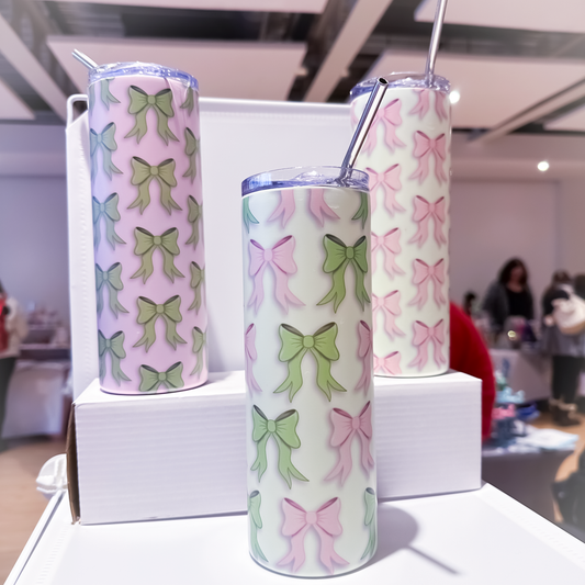 3 tumblers - one with green bows, one with pink bows and another with pink and green bows on