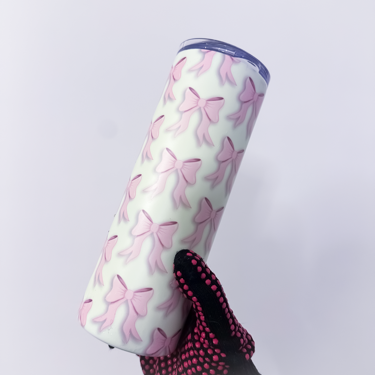Pink tumbler with green bow pattern