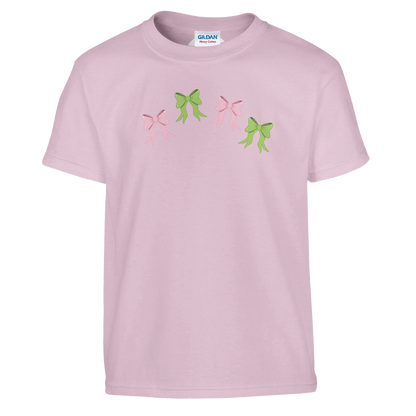 Flat lay of Kids pink t-shirt with pink and green bows design on front