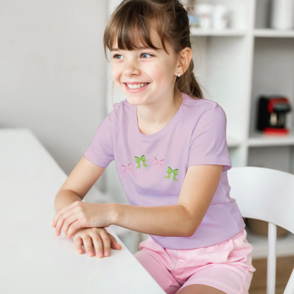 Kids pink t-shirt with pink and green bows design on front