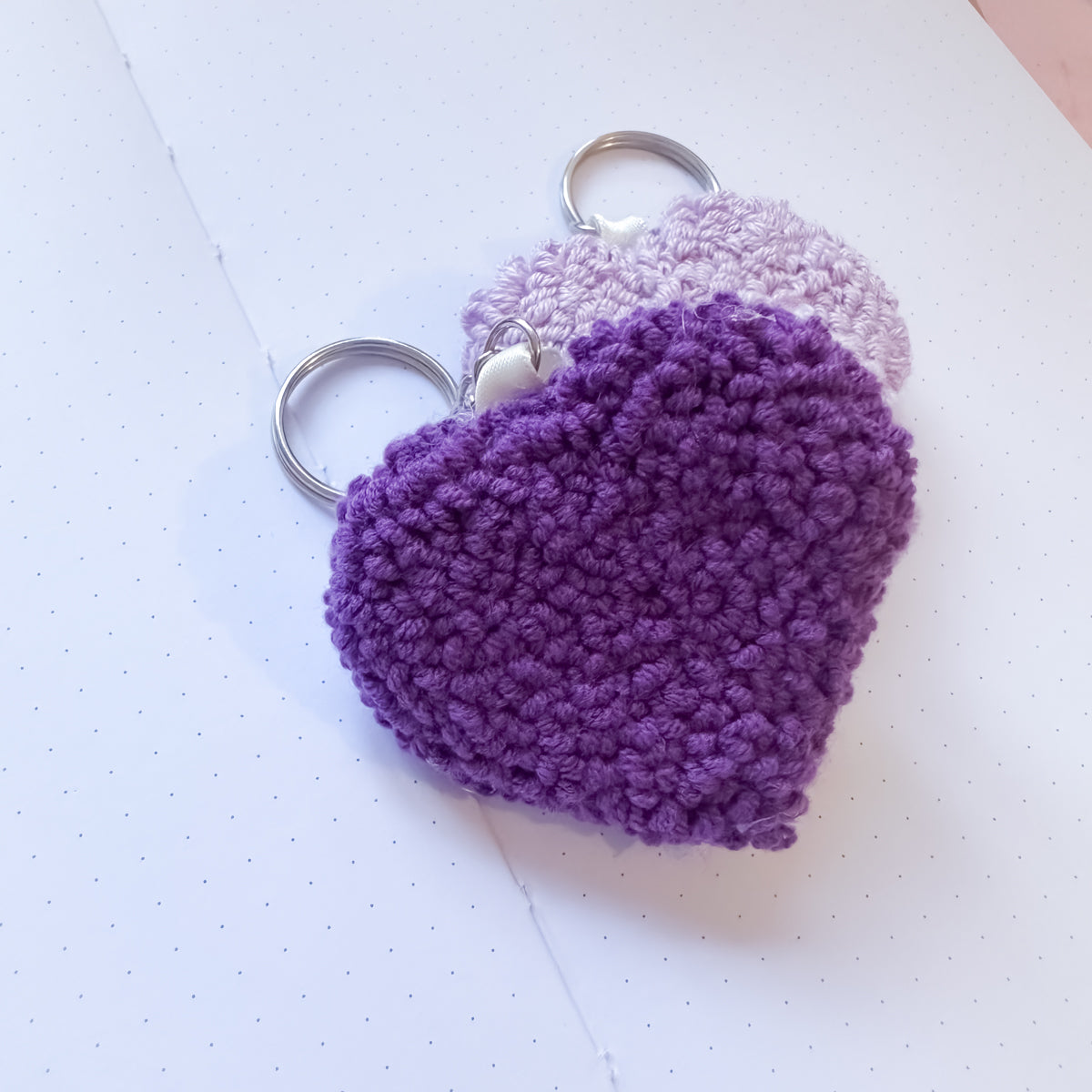 Purple heart-shaped keychain on a white background
