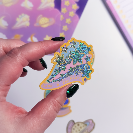 Land in the Stars glitter sticker with celestial illustration