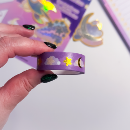 Close-up of gold foil stars and clouds on celestial washi tape
