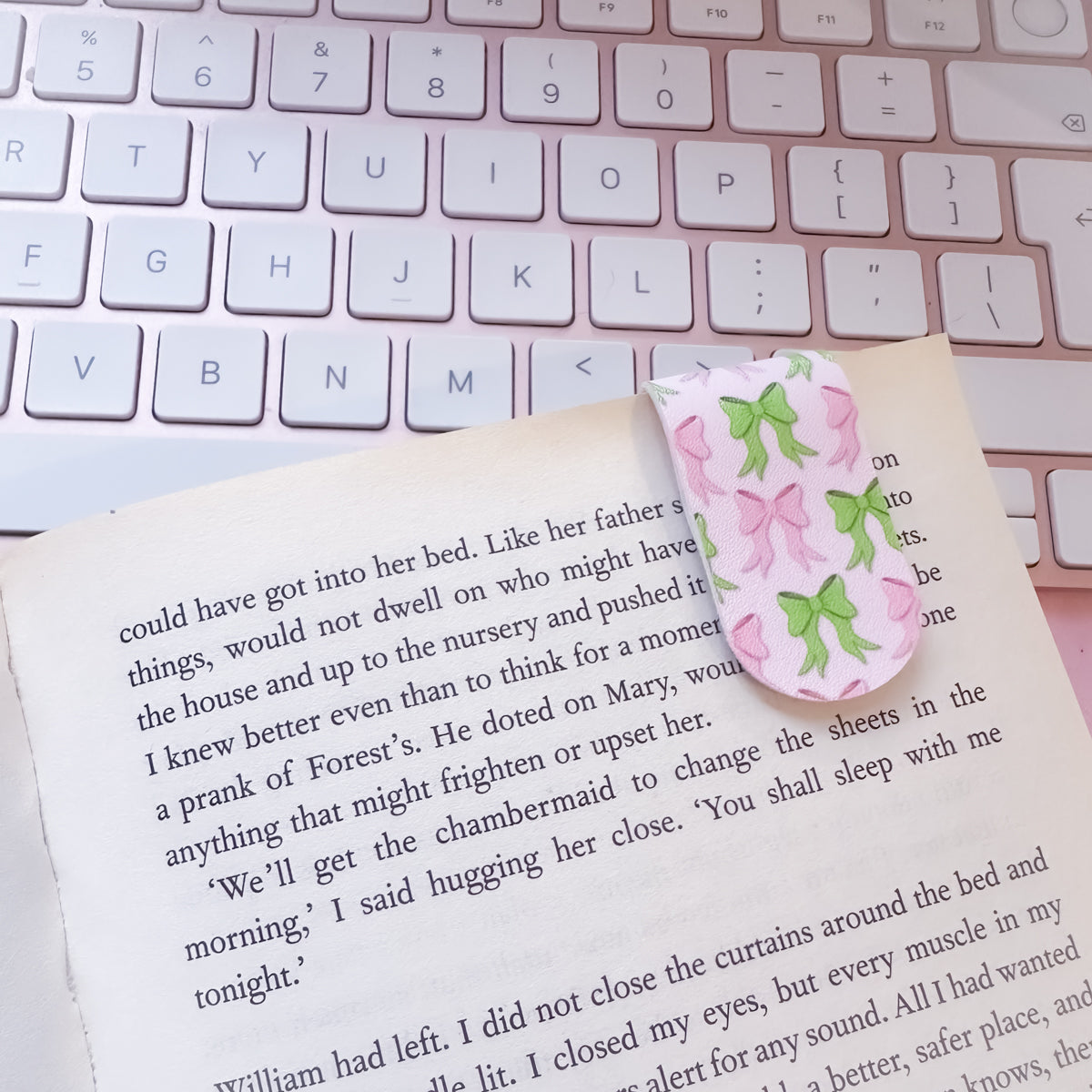 Cute bow bookmarks holding page in book