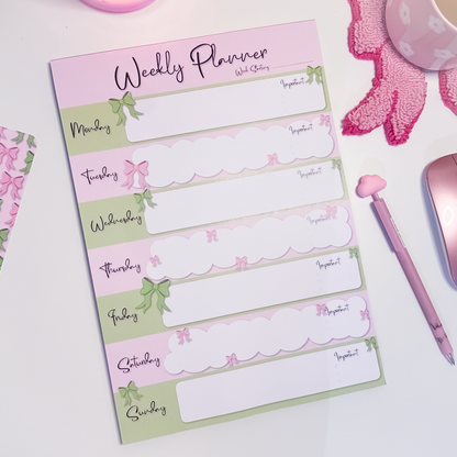 A4 weekly planner notepad with pink and green bow design, Monday to Sunday layout and tick circles for tasks