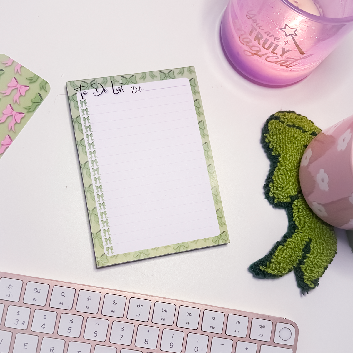Green bows to-do list A6 notepad with whimsical bow illustrations and tick-off design