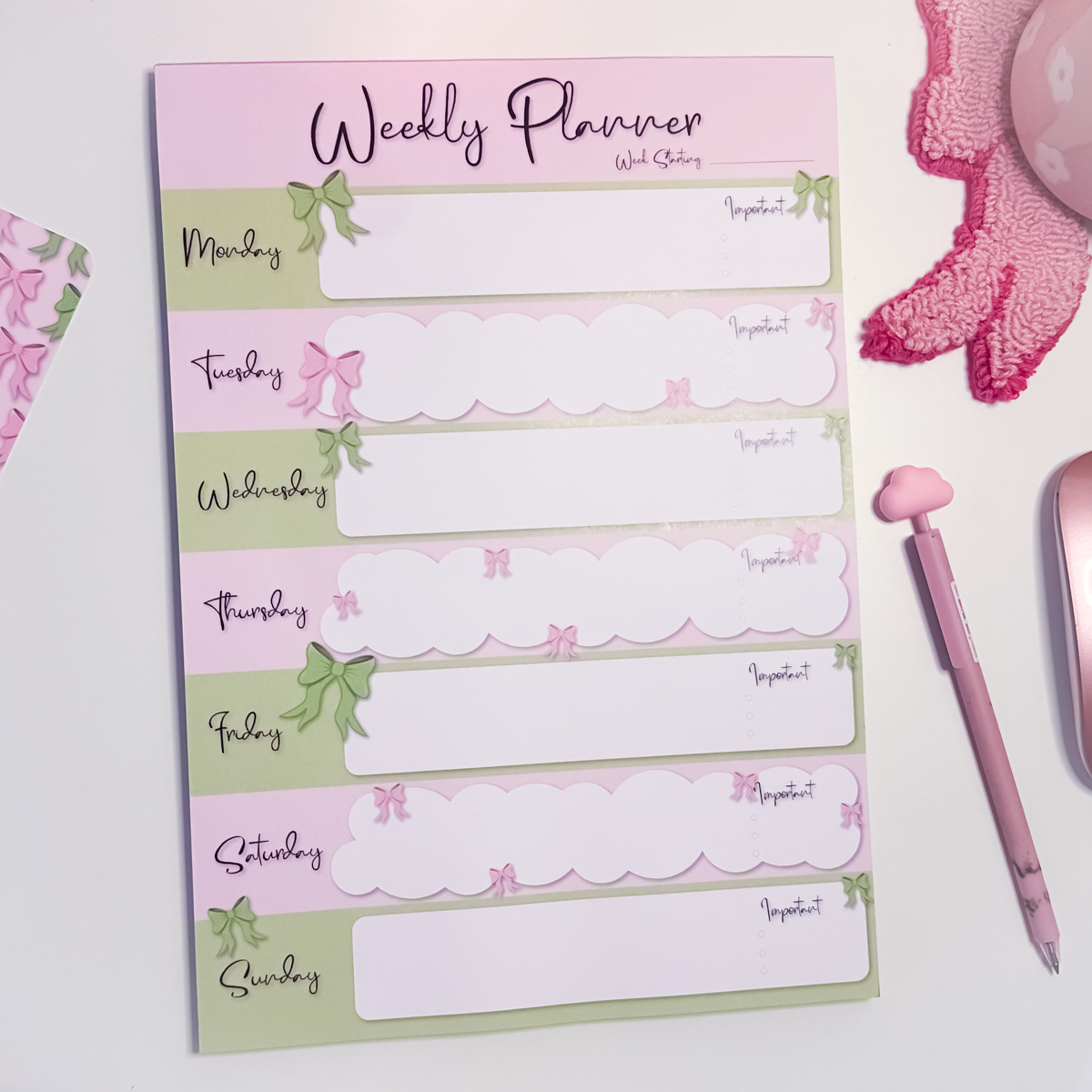 A4 weekly planner notepad with pink and green bow design, Monday to Sunday layout and tick circles for tasks