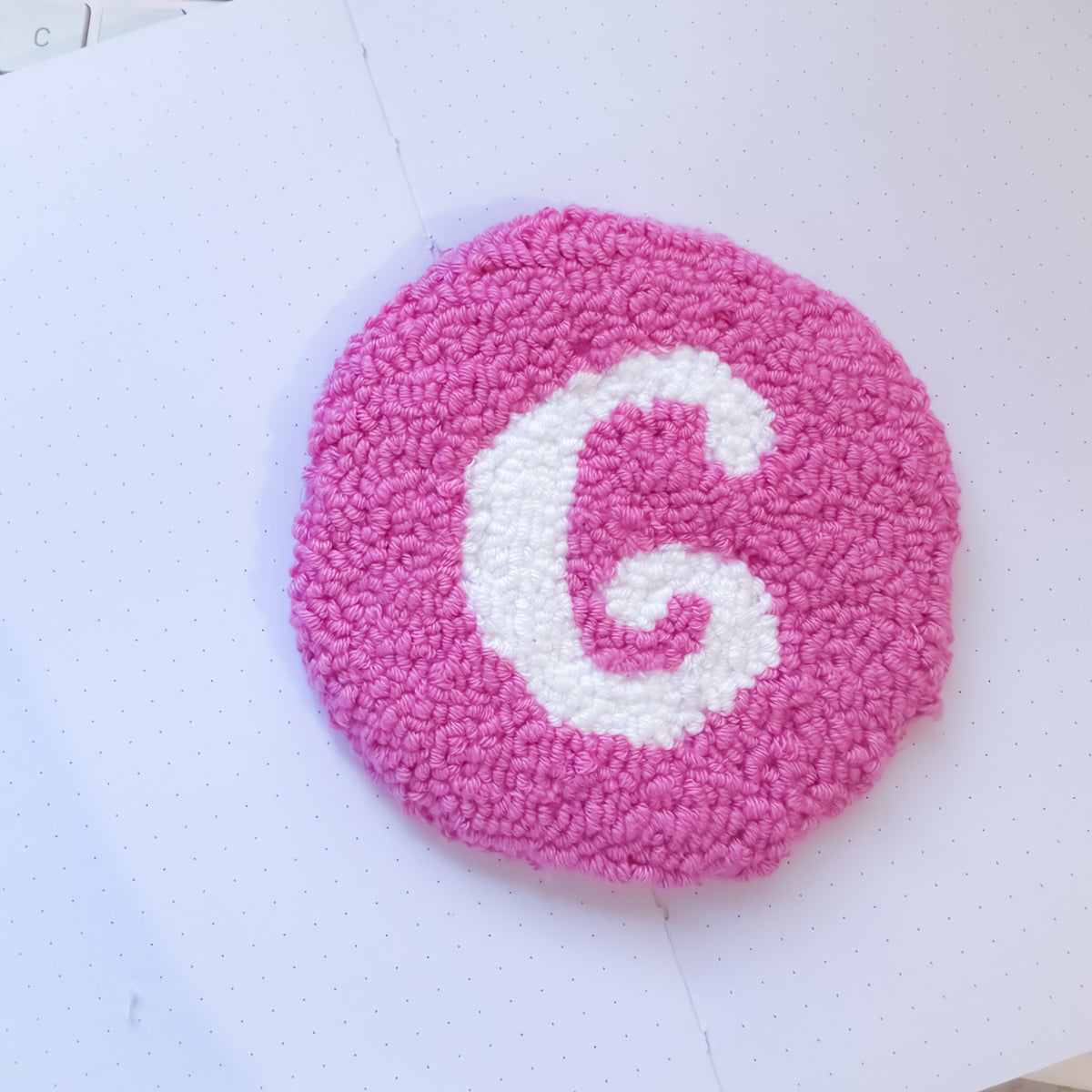 Cute pink coaster with initial for desk setup