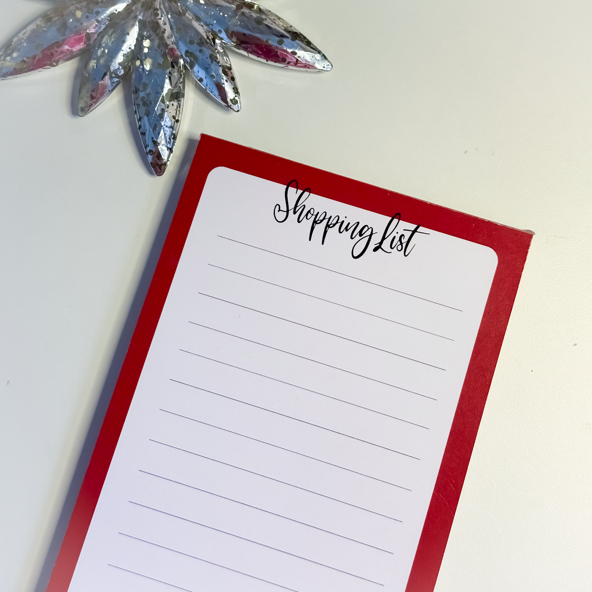 Close up of 'Shopping List' at the top of the notepad