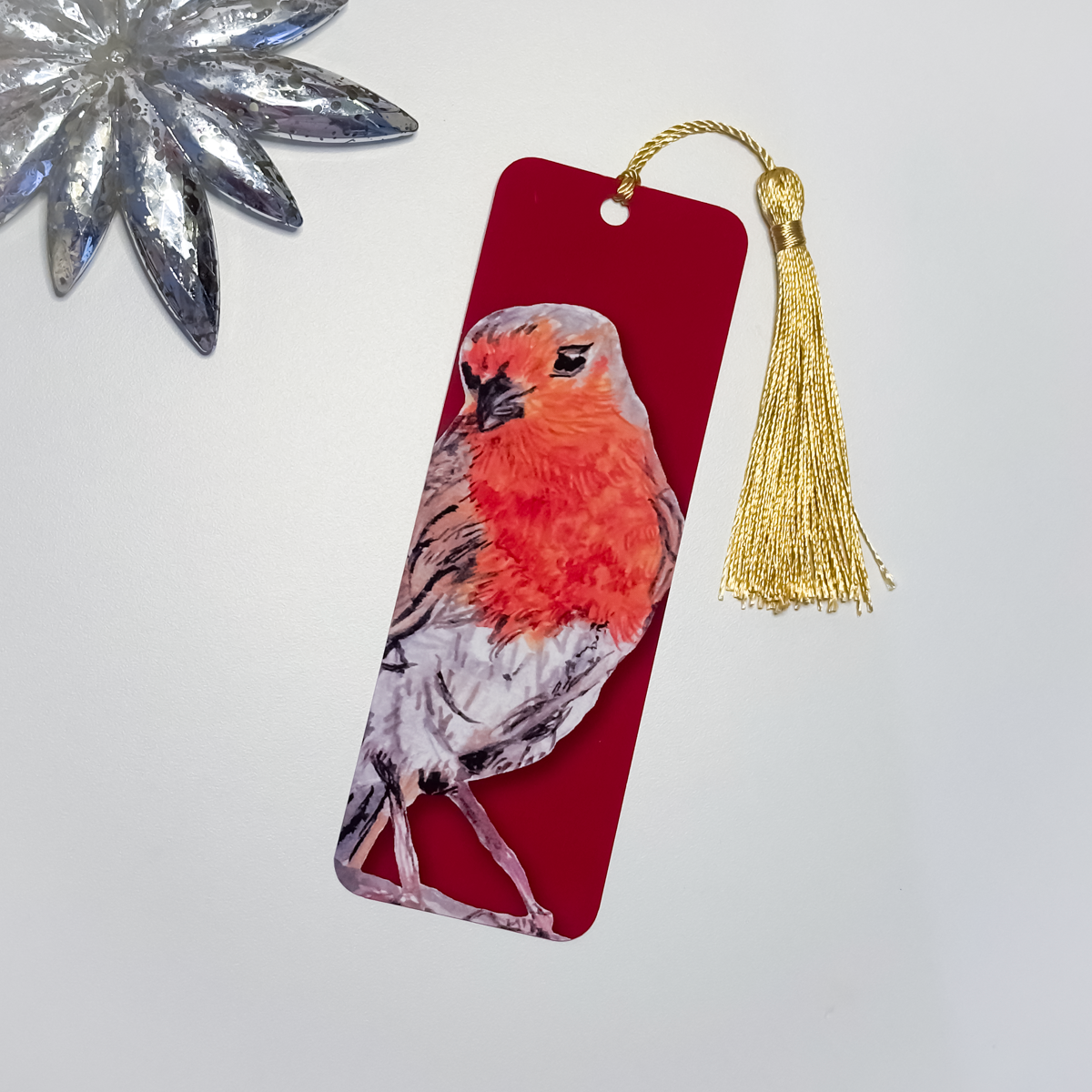 Bookmark with a robin design and gold tassel